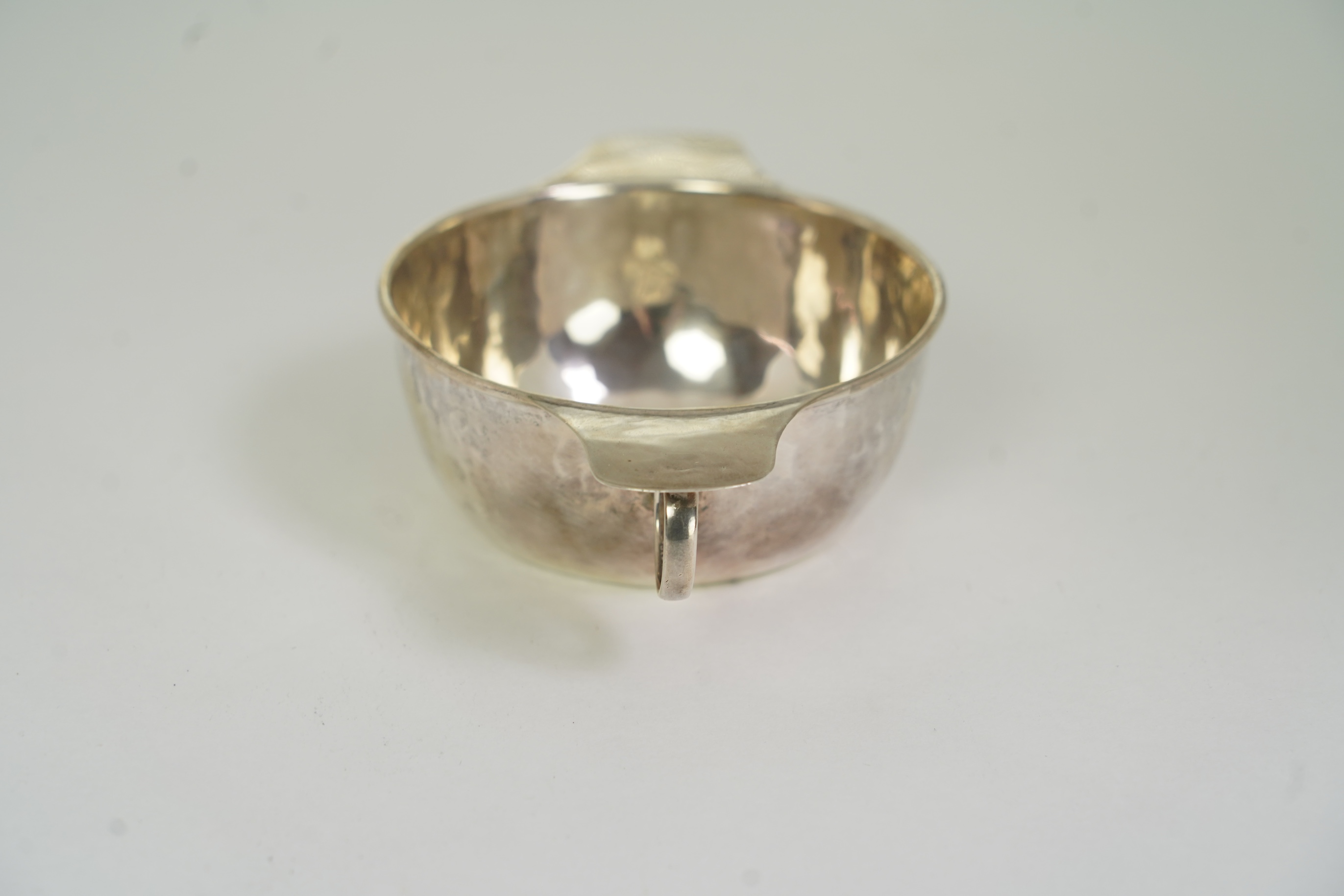 A George V Arts & Crafts Liberty and Co silver porringer